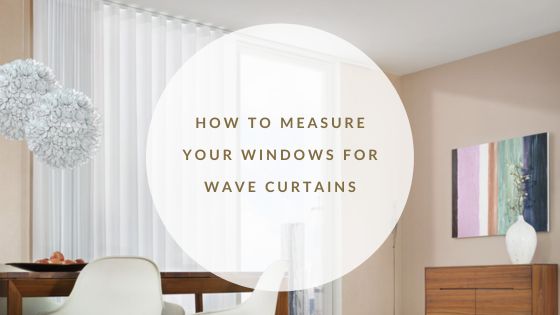 Living room setting with beautiful bi fold doors, adorned with light, sheer white Silent Gliss Wave Curtains